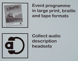 Upper half of the sign outside the Information Desk. The event programme is available in large print, braille and tape formats. Audio description headsets can be collected from the Information Desk.