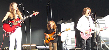 Unity and Devision on stage with their guitars